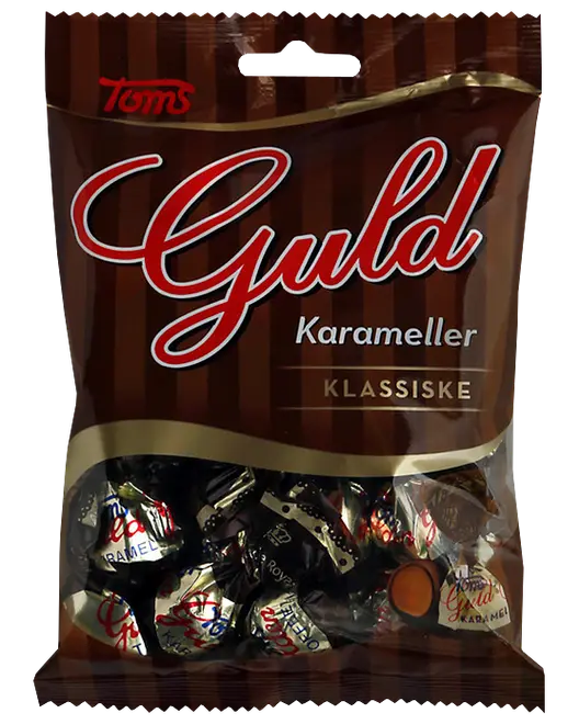 Tom's Guld Klassiske karameller i brun pose med gennemsigtigt vindue nederst, der viser individuelt indpakkede karameller.