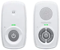 Motorola babyvaktset, två vita enheter med strömknappar, LED-indikatorer, högtalargaller och kontrollknappar för volym och parkoppling. Kompakt och lättanvänt design.