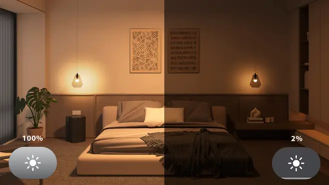 Moderne soveværelse med justerbare pendellamper, viser lysstyrke på 100% og 2%. Platformsseng, neutrale farver, vægkunst og plante. Perfekt til tilpasset stemning.