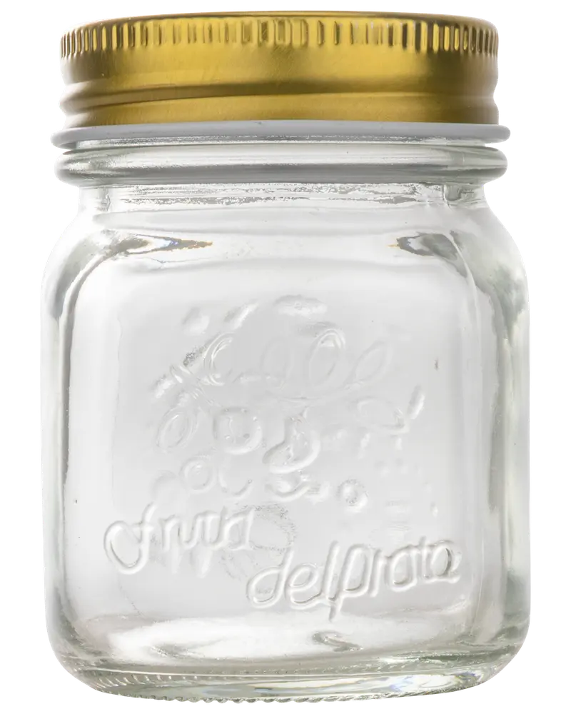 Klar glasburk med fyrkantig form, präglad text på framsidan och ett guldigt metallock. Perfekt för förvaring av sylt, kryddor eller små köksartiklar.