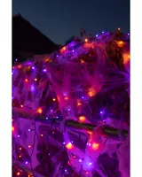 Lila, orange och blå LED-ljusslingor med konstgjorda spindelnät, perfekta för Halloween-dekoration, passar både inomhus och utomhus, skapar en kuslig feststämning.