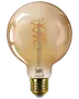 Amberfarvet Philips LED-pære med rund globusform, synlig spiralfilament og gylden skruefatning.