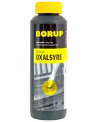 Borup Oxalsyre i sort plastflaske med gul låg og etiket, bruges til blegning, afrensning og fjernelse af pletter på træ. Indeholder tydelige brugsanvisninger på emballagen.