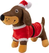 Plyshundelegetøj formet som en brun gravhund, iført rød julemandsdragt med hvid kant og nissehue. Blødt stof, broderede ansigtstræk, festligt juletema.