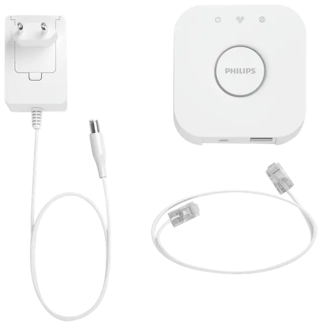 Philips Hue Bridge sæt med hvid firkantet hub, strømadapter med kabel og Ethernet-kabel. Til smart belysningsstyring. Kompakt og moderne design.