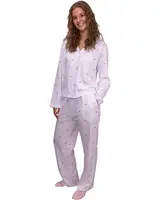 Dam-pyjamaset med långärmad tröja och byxor, vitt tyg med små röda polkagrisar, knappar framtill, avslappnad passform, perfekt för sömn och mys.