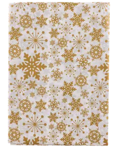 Vitt presentpapper med gyllene snöflingor och stjärnmönster i olika storlekar. Festlig och elegant design med slät yta, perfekt för presentinslagning.