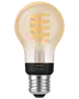 Philips Hue LED filamentpære med spiraldesign, E27 sokkel, klart glas, varm hvidt lys, smart home kompatibel, vintage stil, energieffektiv, velegnet til dekorativ belysning.
