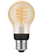 Philips Hue LED filamentpære med spiraldesign, E27 sokkel, klart glas, varm hvidt lys, smart home kompatibel, vintage stil, energieffektiv, velegnet til dekorativ belysning.